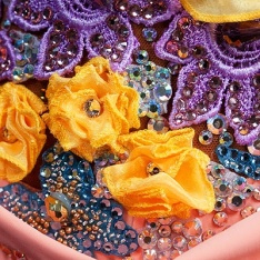 Dress Embellishment by (Source Unknown) Interesting layering and use of applique for texture.
